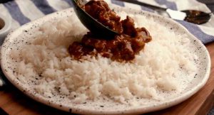 pour rice on a plate, then pour the meat