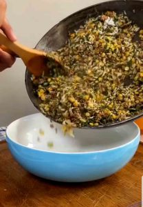 Mixing and preparing the ingredients inside the dolmeh bademjan
