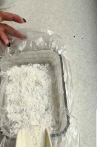 some flour on the bottom of the mold