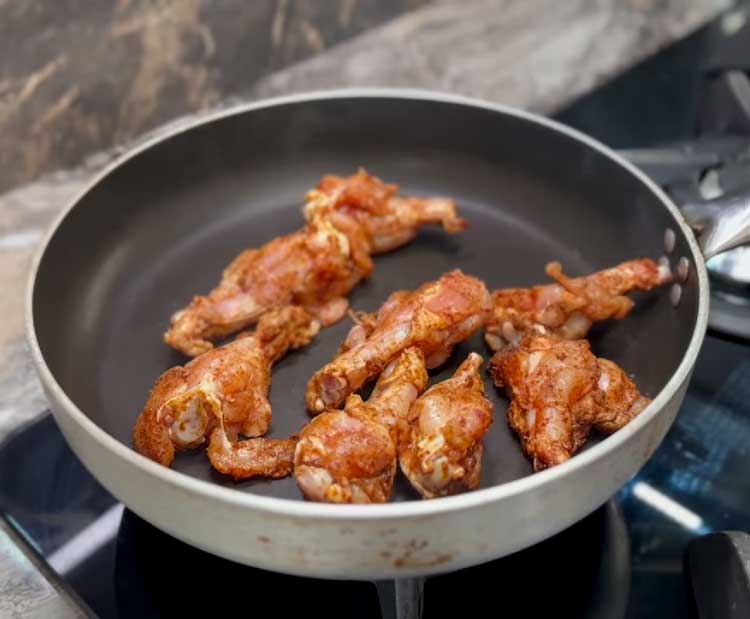 add chicken wings to the pan